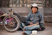 With no use of his legs, this man has a modified hand-pedaled trike he uses to transport himself around.  He plays music on a hand-made walaycho, a Peruvian stringed instrument, to make a living.  San Pedro Marketplace, Cusco, Peru.: by lukemyers, Views[1226]