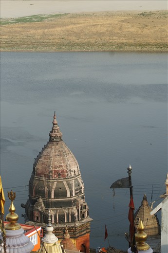 An Old monument looks over a funeral pyre ready to be lit