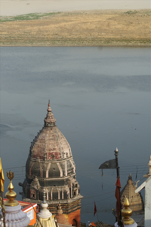 An Old monument looks over a funeral pyre ready to be lit