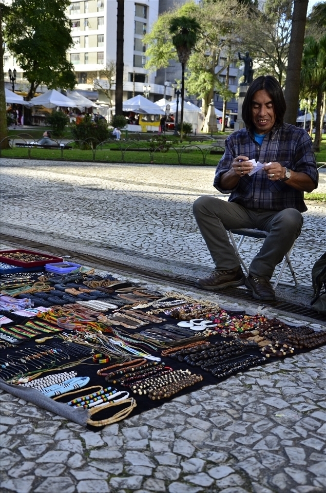 At the Santos Andrade Square, the place I have visited, Juan is a hawker.