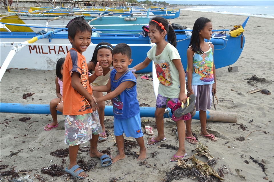 SWEET SMILES- While preparing for a team building activity at the shoreline I met this group of kids from the Fisherman's Village of Darapidap, Ilocos Sur, Philippines. They gave me their sweet smiles despite of the gloomy weather that afternoon.