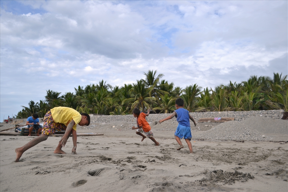 THE PLAY- While our group activity is on going, these boys started their own play along the sand. They started chasing each other while pretending to be airplanes.