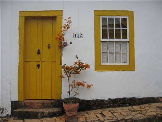 A local tailor closes her door to the public at the end of a long day.
