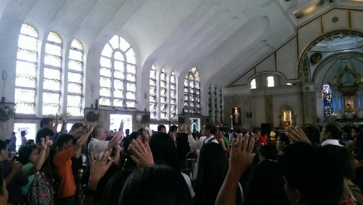 Holy water bbeing sprayed at Quiapo Church