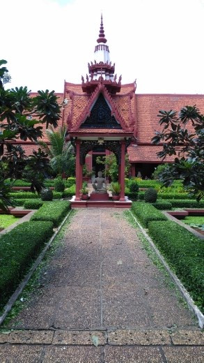 Buddha statue in centre of courtyard in museum