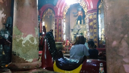 Thanh Hoang, the Chief of Hell; to the left is his red horse