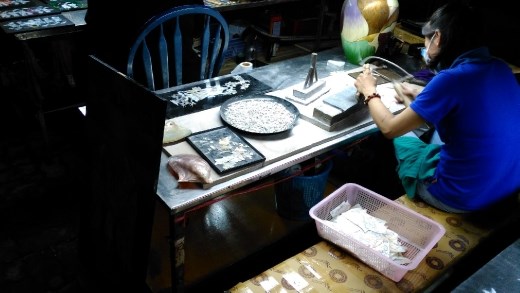 Mother of Pearl wood art made by victims of agent orange