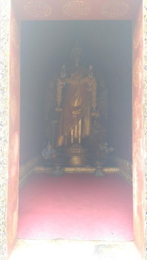 The library housing a standing Buddha