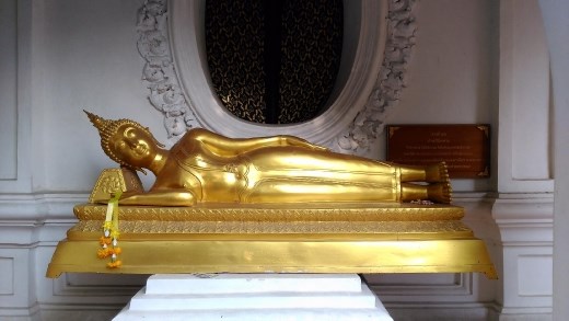Phra Pathom Chedi School - Cloister with various Buddha entering Nirvana statue