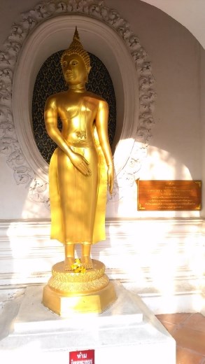 Phra Pathom Chedi School - Cloister with various Buddha looking back at the city of Vaishali