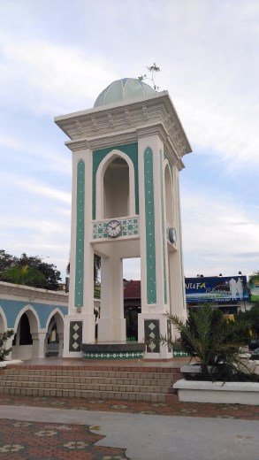 Broken clock tower at mosque