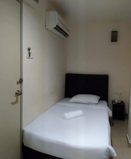 Tiny windowless hotel room