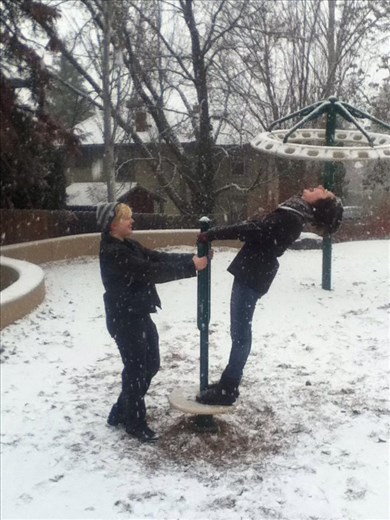 Two of my friends having fun in the snow. 