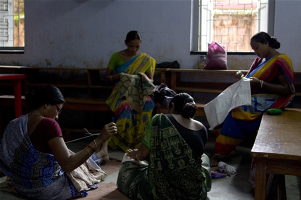 
Women from a village near Madurdaha embroider bags at Dakshini Prayash, a Calcutta based NGO that assists them to market handmade goods. The society also holds training sessions, including sewing classes, which impart the skills necessary for these women to become self-sufficient. 
