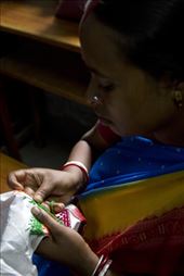Shabitri, 36, will spend a few hours stitching an elaborate pattern on to cloth that will become a bag. One bag sells for Rs.500 ($8) and the steady flow of income helps Shabitri provide for her children who go to the Dakshini Prayash School. : by madschowdhury, Views[639]