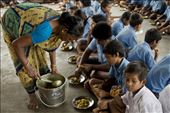 Didi, the resident chef, gives the students poori-aloo (potatoes and bread) that she has lovingly cooked herself. The free lunch provided was one of the main reasons the students here first started coming to school 20 years ago. : by madschowdhury, Views[355]