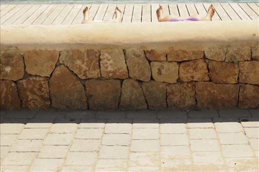 Two girls are sunbathing in Sant Antoni de Portmany
