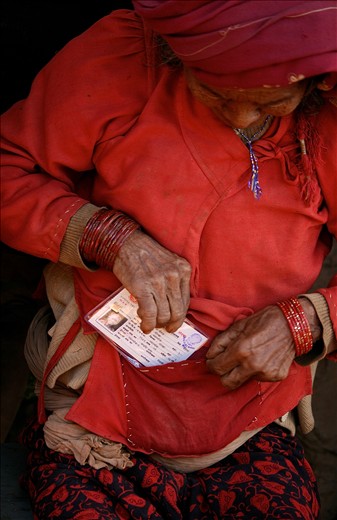 Her entire life, until she held this slip of paper, she was stateless within her own country. This Chepang woman tucks away her new Nepali citizenship card which facilitates access to rights that she has never previously known. 