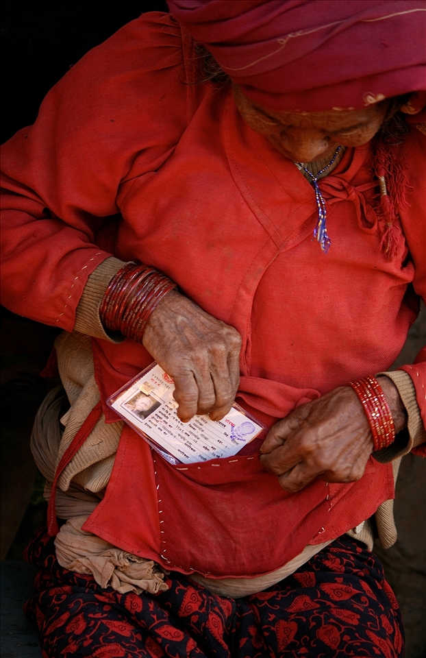 Her entire life, until she held this slip of paper, she was stateless within her own country. This Chepang woman tucks away her new Nepali citizenship card which facilitates access to rights that she has never previously known. 
