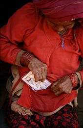 Her entire life, until she held this slip of paper, she was stateless within her own country. This Chepang woman tucks away her new Nepali citizenship card which facilitates access to rights that she has never previously known. : by magdalena_smieszek, Views[544]
