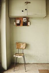 SOLITUDE A worn and expectant chair; the start of a new day. The Laundromat is a silent meeting place for people of all walks of life. A common ground, where mutual respect is established and common societal boundaries are dissolved. This chair sees all who come in and out, and by the look of it, becomes intimate with many. The chair is weary, but also refelcts a peaceful calm. A perfect metaphor for the laundromat itself.: by maggiebeatrice, Views[2192]