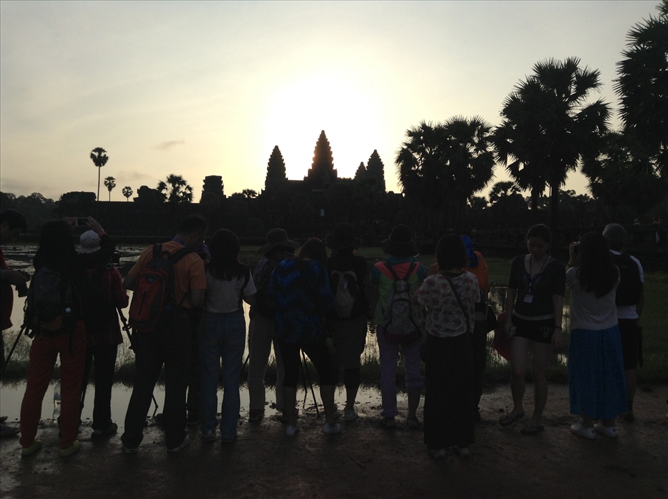 Sunrise at Angkor Wat Temple. People from five continents are there just for one reason to see World Heritage Site. 