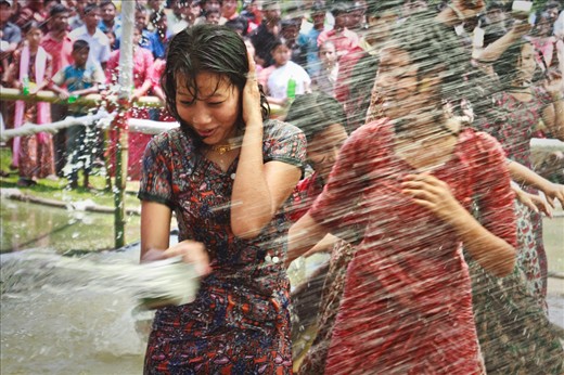 Water Festival:
At the eve of New Year they celebrate water festival by splashing water from two sides of a marked arena by unmarried boys and girls on each other. It is said that splashing water is a way of declaring a love interest to him/her.
