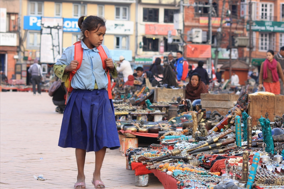 A girl looking at the street stalls in the area near Basantapur 
