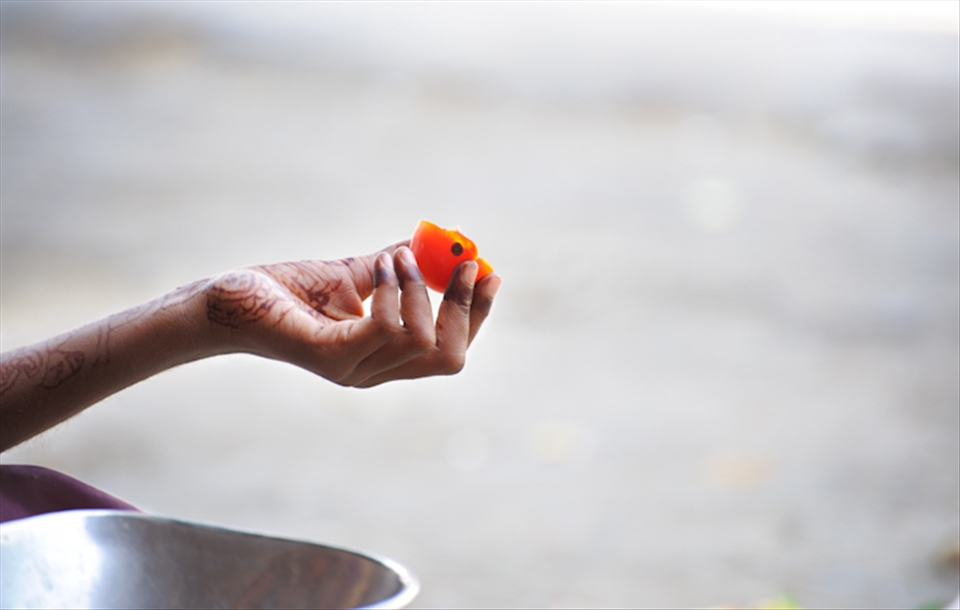 A young girl observing her meal