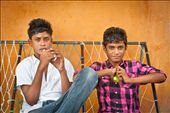 Two Maldivian teenagers relax in the street. Most island settlements feature small Islamic schools where children are taught in small classes.: by maldives, Views[796]