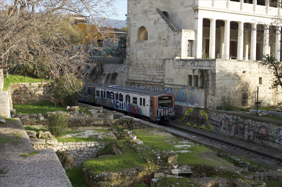 Under the Acropolis, the city train passes through the ancient Athenian market.