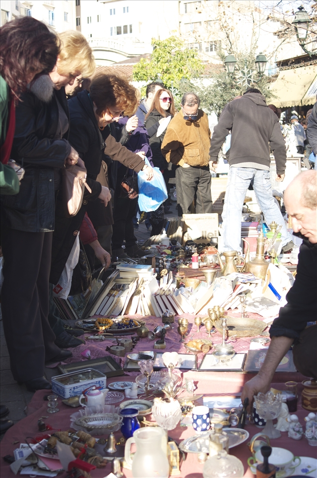 Pedlars selling antiques in the back alleys of todays Athenian market.