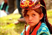 Meet Zarmina, 10, lost in innocent thoughts as her village gears for the <i>Joshi</i> spring festival, held in late May each year to mark the passing of the cold season and the planting of new crops. 
<p>
Zarmina is a <i>Kalasha</i>, progeny of an ancient Indo-Iranian tribe that has fascinated travelers and mystified anthropologists for centuries. The polytheistic Kalash once thrived in the fertile valleys of the Hindu Kush mountains in present-day Pakistan; today, with their distinctive religion and cultural practices under constant threat from Muslim proselytism, the Kalash are among the most endangered peoples in the world.: by manalahmad, Views[628]