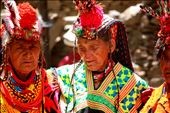 Three Kalasha matriarchs, decked in traditional finery, their faces wizened by the harsh mountain sun and long days of work in the fields, dance arm-in-arm during Joshi festivities. 
<p>
A world apart from the conservative, male-dominated,predominantly Muslim society of Pakistan, the women of Kalash enjoy certain exceptional freedoms. They do not observe <i>purdah</i>, they mix openly with men, and they customarily choose their own husbands, whom they are allowed to divorce at will. The goddess Jestak, protector of home and hearth, holds an important place in the Kalash pantheon, and the four-day spring festival normally kicks off with sacrifices made in her honor. 
: by manalahmad, Views[676]
