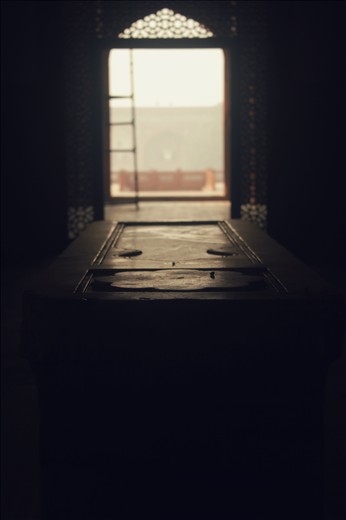 His tomb lies there, in complete silence. Silence that speaks a hundred tales. Somewhere beneath this marble lies a king, defeated and sleeping.