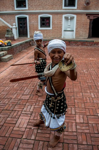 Kids practising for the mask festival called Intrajatra, a festival for Intra, god of rain. After every monsoon season they celebrate the festival to say thanks to indra.
Unlike other asian countries Nepal has never been contaminated with the thronging tourists. People still live a modest life, unchanged from their heritage. even these kids who are practicing the traditional dance were innocents without any inhibitions toward the tourists.     
