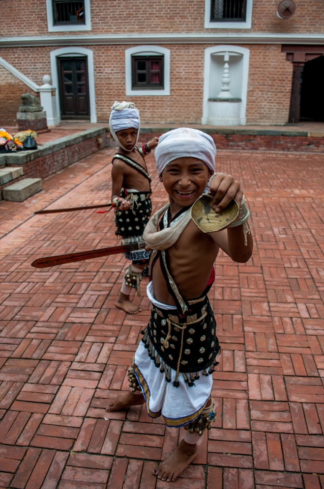 Kids practising for the mask festival called Intrajatra, a festival for Intra, god of rain. After every monsoon season they celebrate the festival to say thanks to indra.
Unlike other asian countries Nepal has never been contaminated with the thronging tourists. People still live a modest life, unchanged from their heritage. even these kids who are practicing the traditional dance were innocents without any inhibitions toward the tourists.     