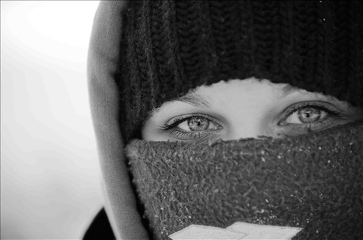 Jessica Cousineau bundles up for a snowmobile ride across the Rainy Lake.