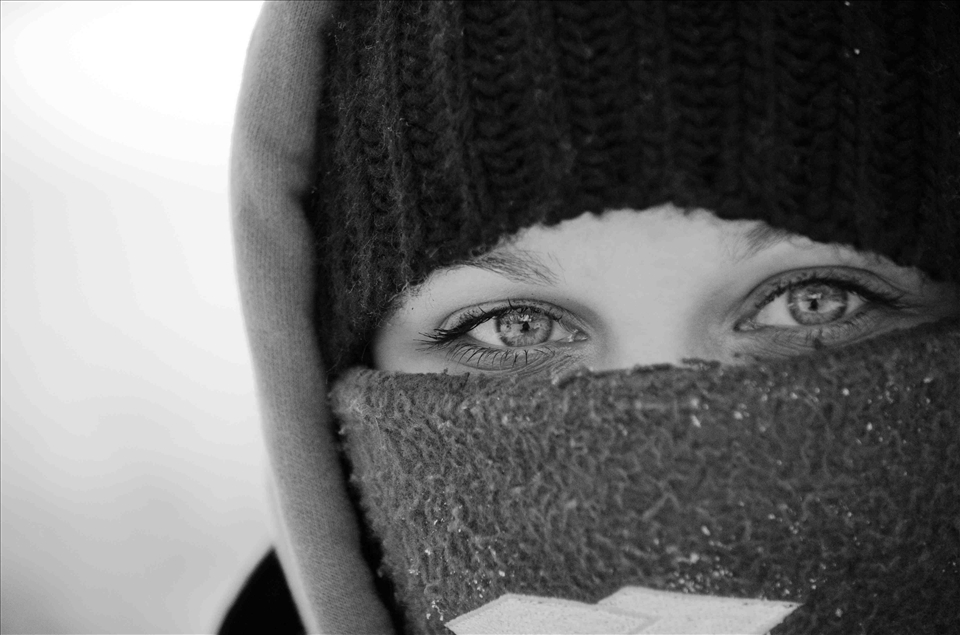 Jessica Cousineau bundles up for a snowmobile ride across the Rainy Lake.