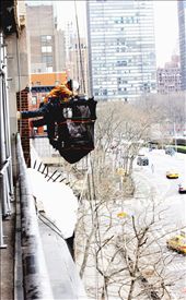 Three immigrants work installing windows in the large office buildings of New York. Most of these workers are part of the underpaid manpower chain.  : by maoneira, Views[193]