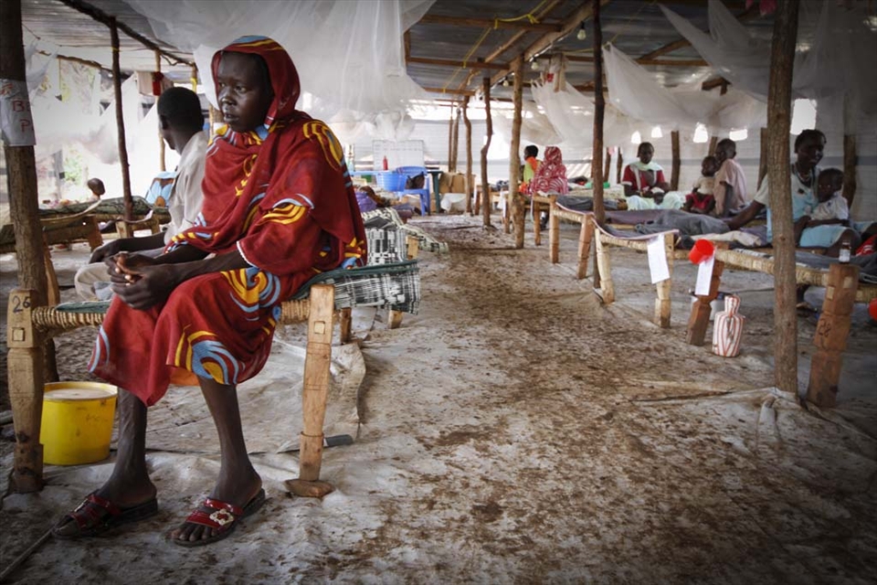 A sick mother waits to be examined in Yusuf Batil camp's hospital, South Sudan.