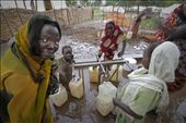 Women gather at a borehole in the camp to gather water for cooking and laundry. : by marc_ellison, Views[241]