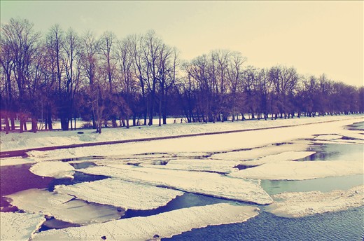 A classic park in Saint Petersburg, two men, one in a bike and the other running