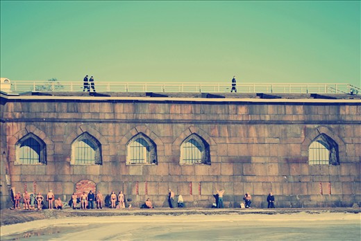 People taking the sun at the Peter and Paul Fortress in Saint Petersburg