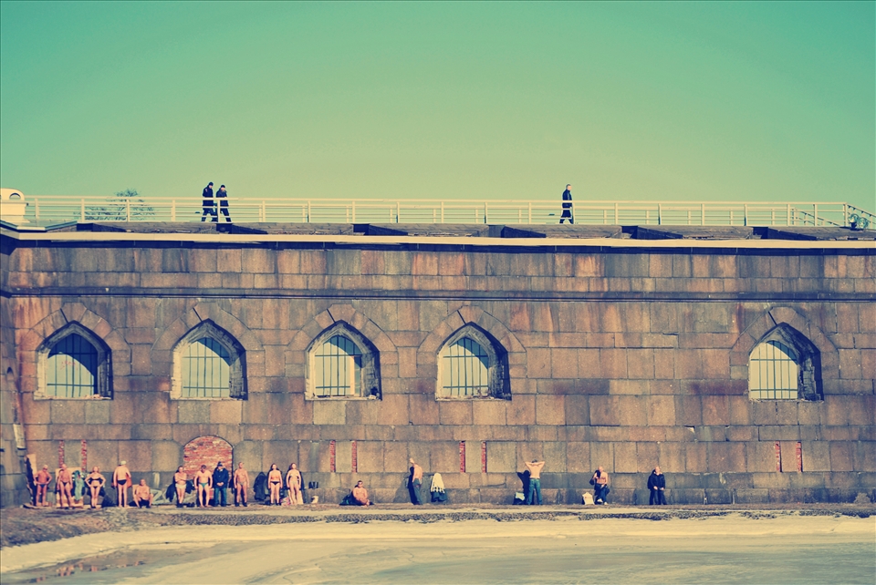 People taking the sun at the Peter and Paul Fortress in Saint Petersburg