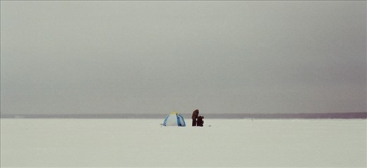 Saint Petersburg, Two fisherman camping on the frozen sea. 
