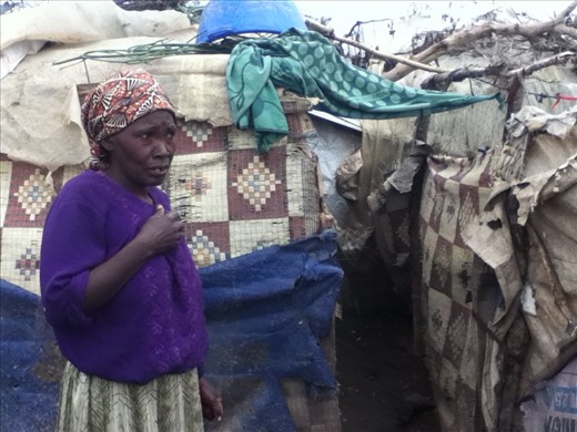 A Vumilia IDP Camp woman who showed us her 'house'. Heartbreaking