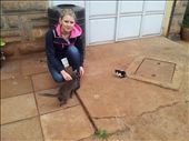 One of the volunteers at Pastor Regina's house with the kitty and its unbelievably small companion.: by marciechiwi, Views[822]