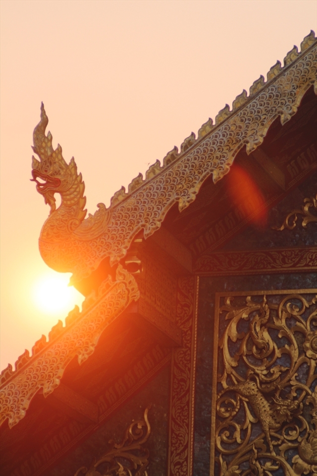 The sun sets against Wat Phra Singh. Located in Chiang Mai’s old centre the temple buildings date back to 1345.