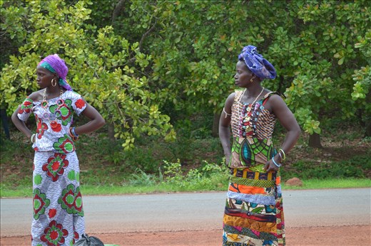 Women in tradional dresses walking to the open market on Saturday. Guinea Bissau
